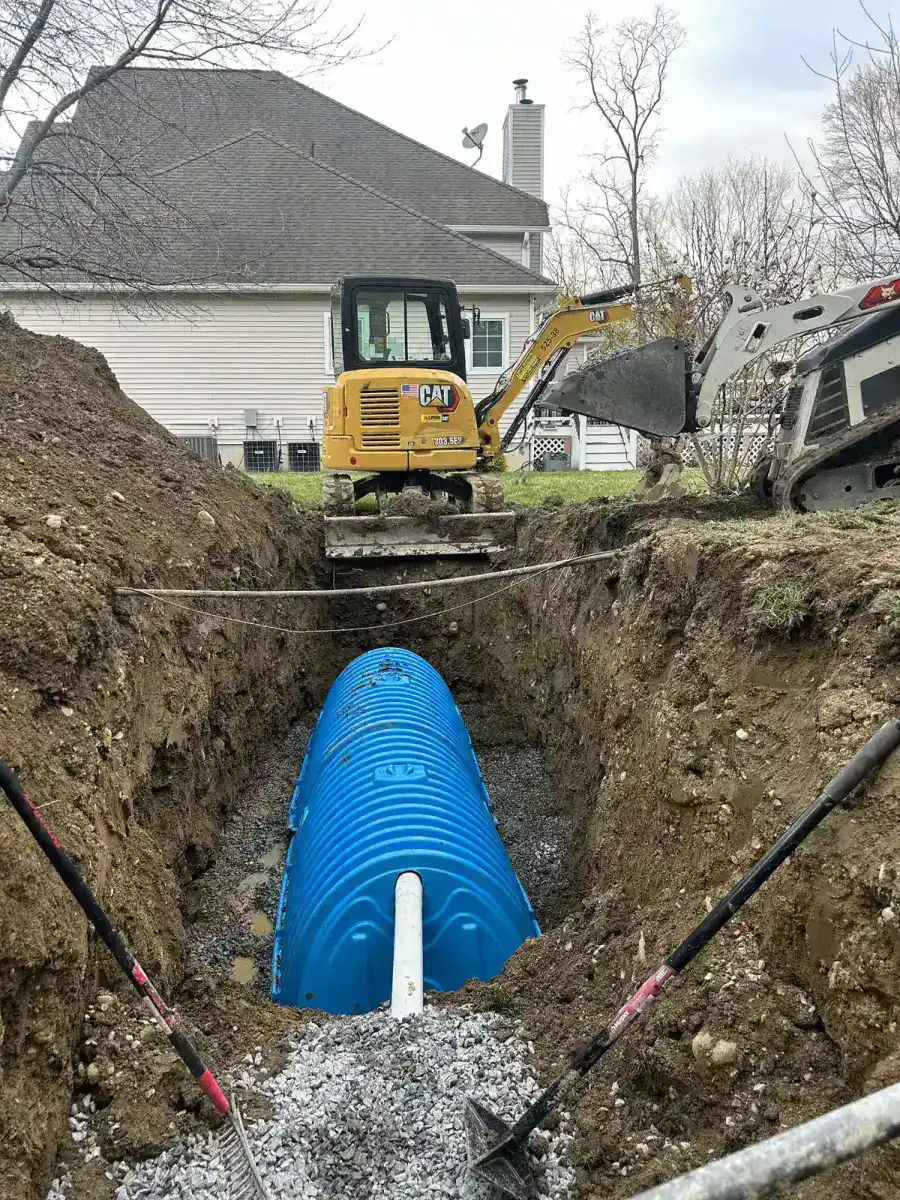 French drain pipe and gravel bed installation