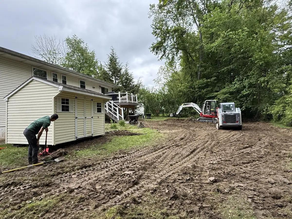 Excavation crew with excavator grading a property in Hopewell Junction