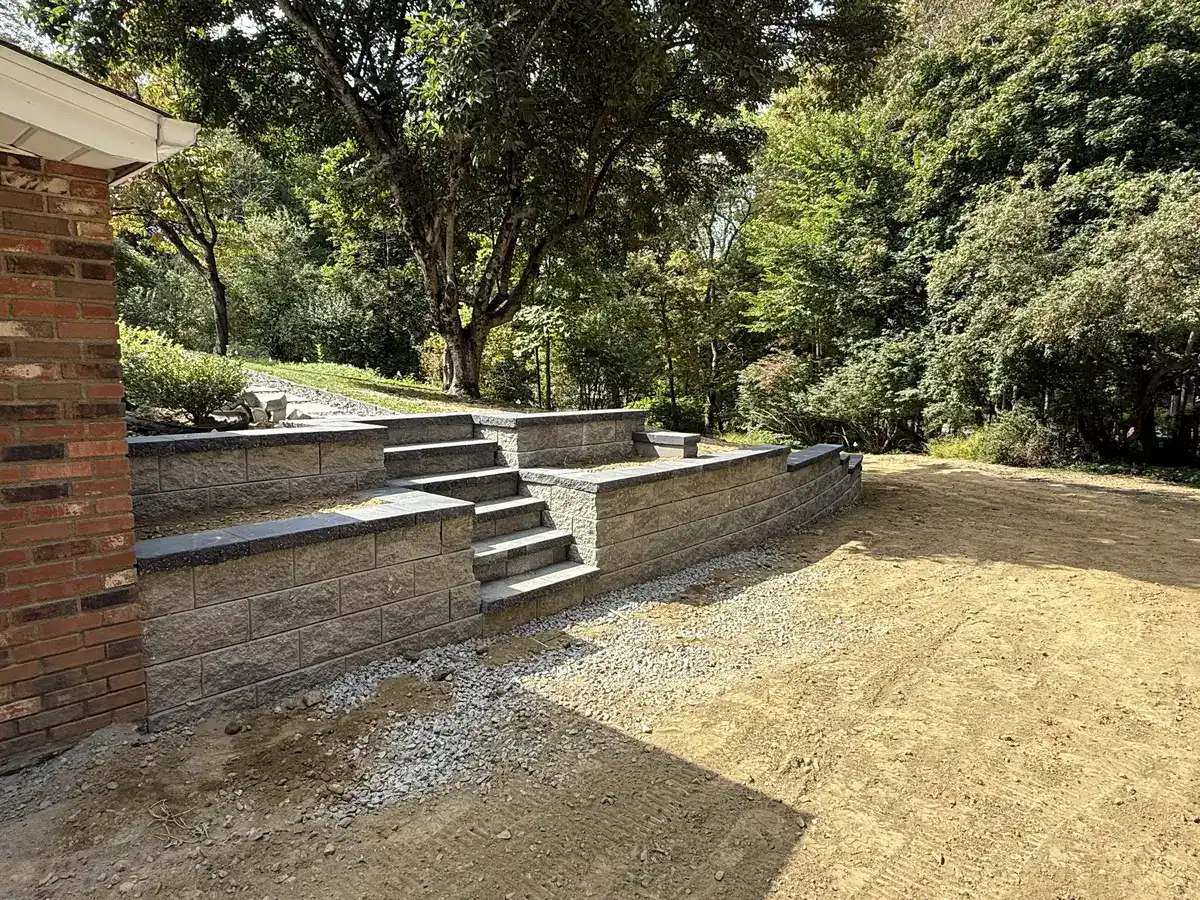 Stone block retaining wall with integrated steps in Dutchess County