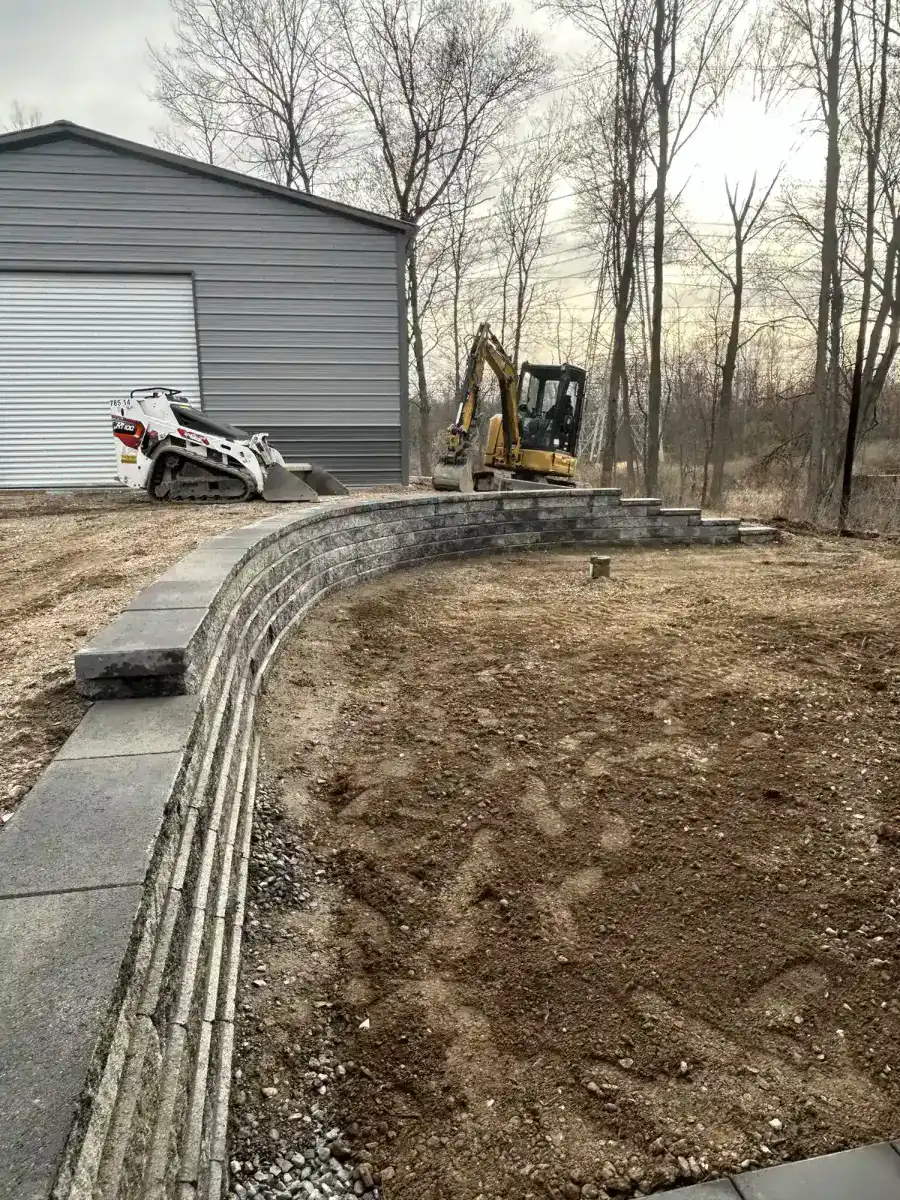 Curved retaining wall construction in progress