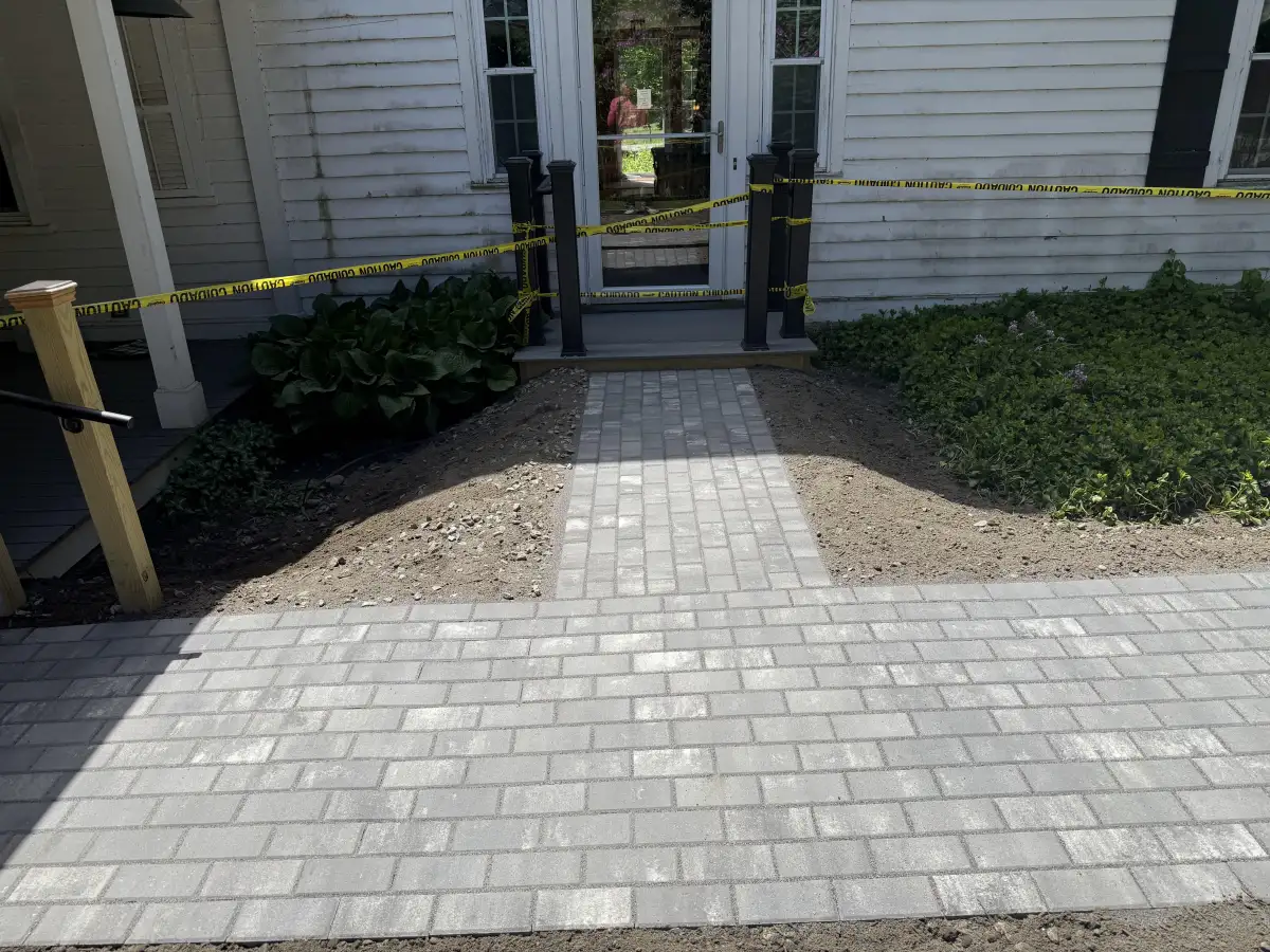 Clean paver walkway leading to front door after pressure washing